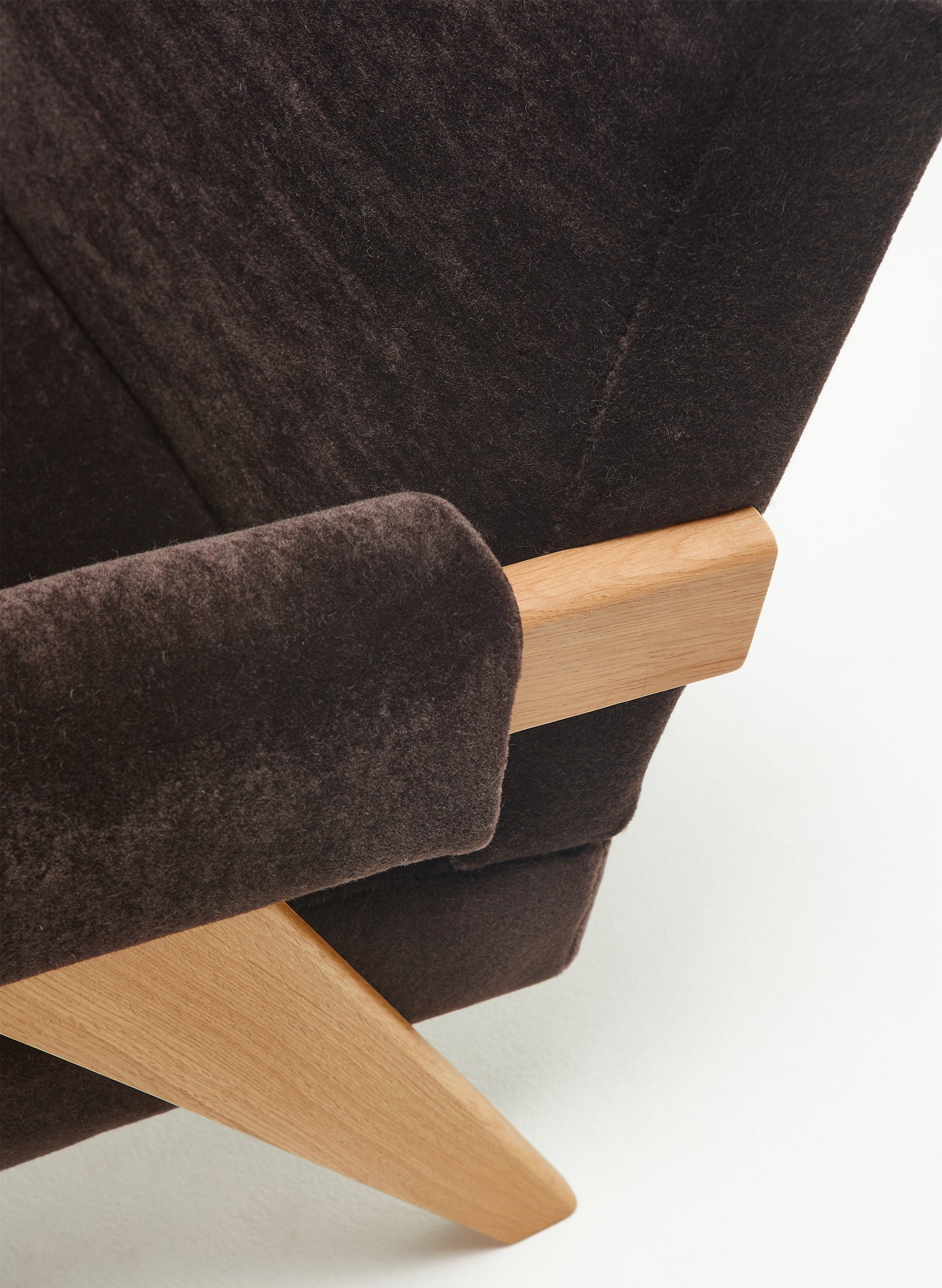 Close-up 1 of an authentic chandigarh lounge chair, pierre jeanneret era, natural oak frame, pierre frey choco teddy mohair upholstery, by Klarel #K35-31
