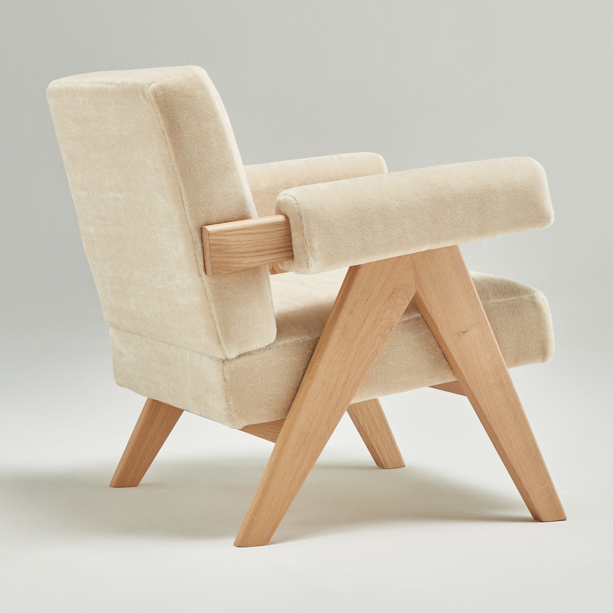 Back view of an authentic chandigarh lounge chair, pierre jeanneret era, natural oak frame, pierre frey sable teddy mohair upholstery, by Klarel #K35-35