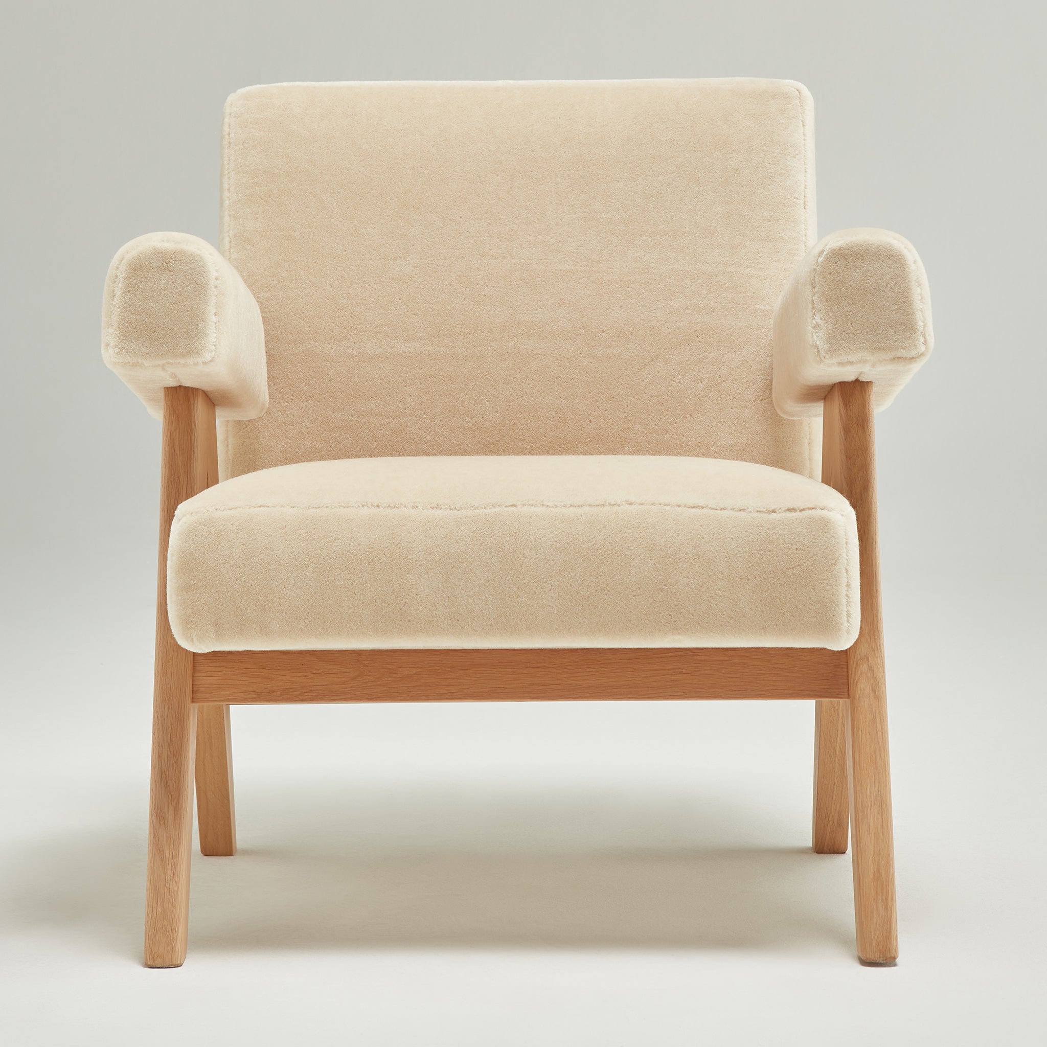 Front view of an authentic chandigarh lounge chair, pierre jeanneret era, natural oak frame, pierre frey sable teddy mohair upholstery, by Klarel #K35-35