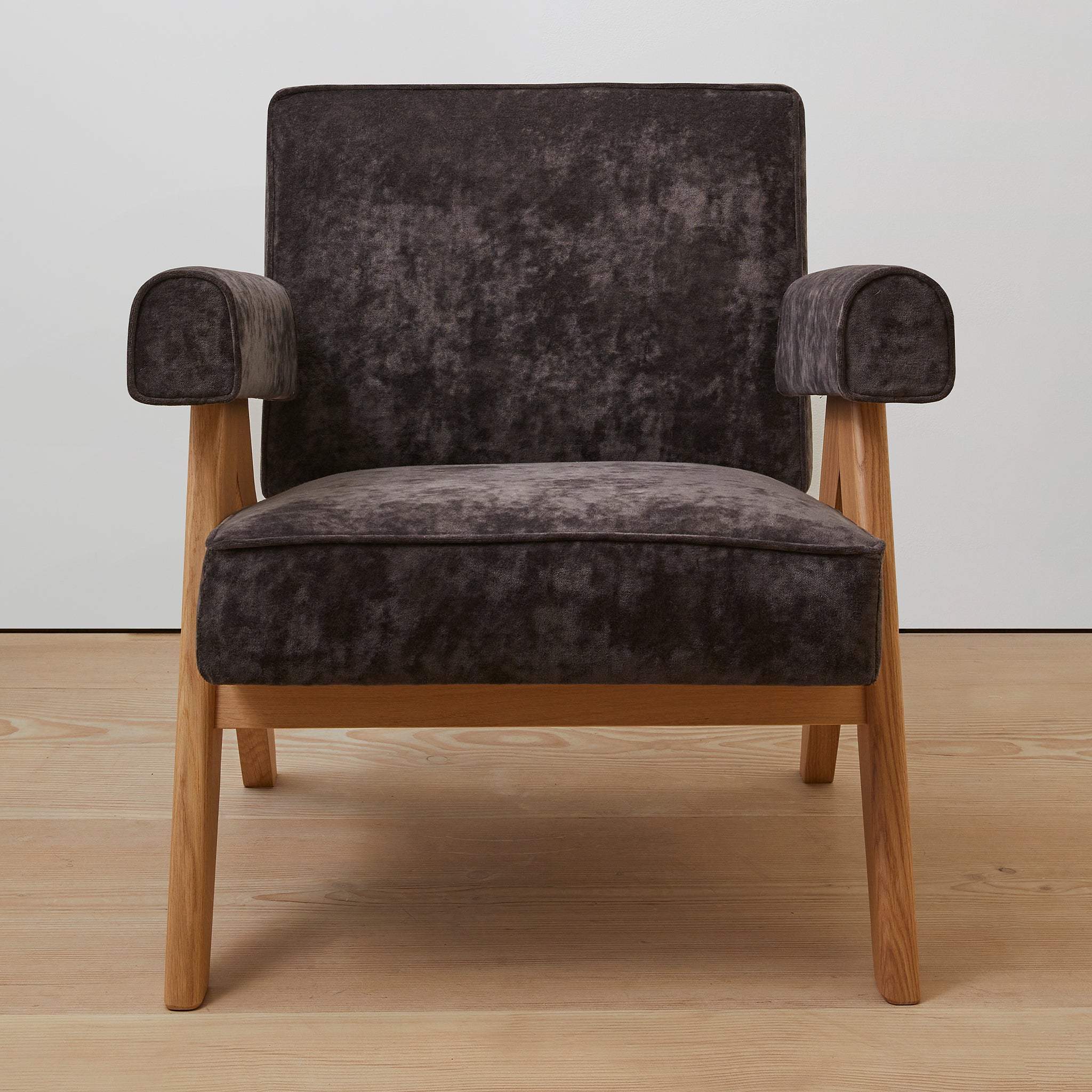 Front view of an authentic chandigarh lounge chair, pierre jeanneret era, natural oak frame, chocolate brown mohair upholstery, by Klarel #K35-36