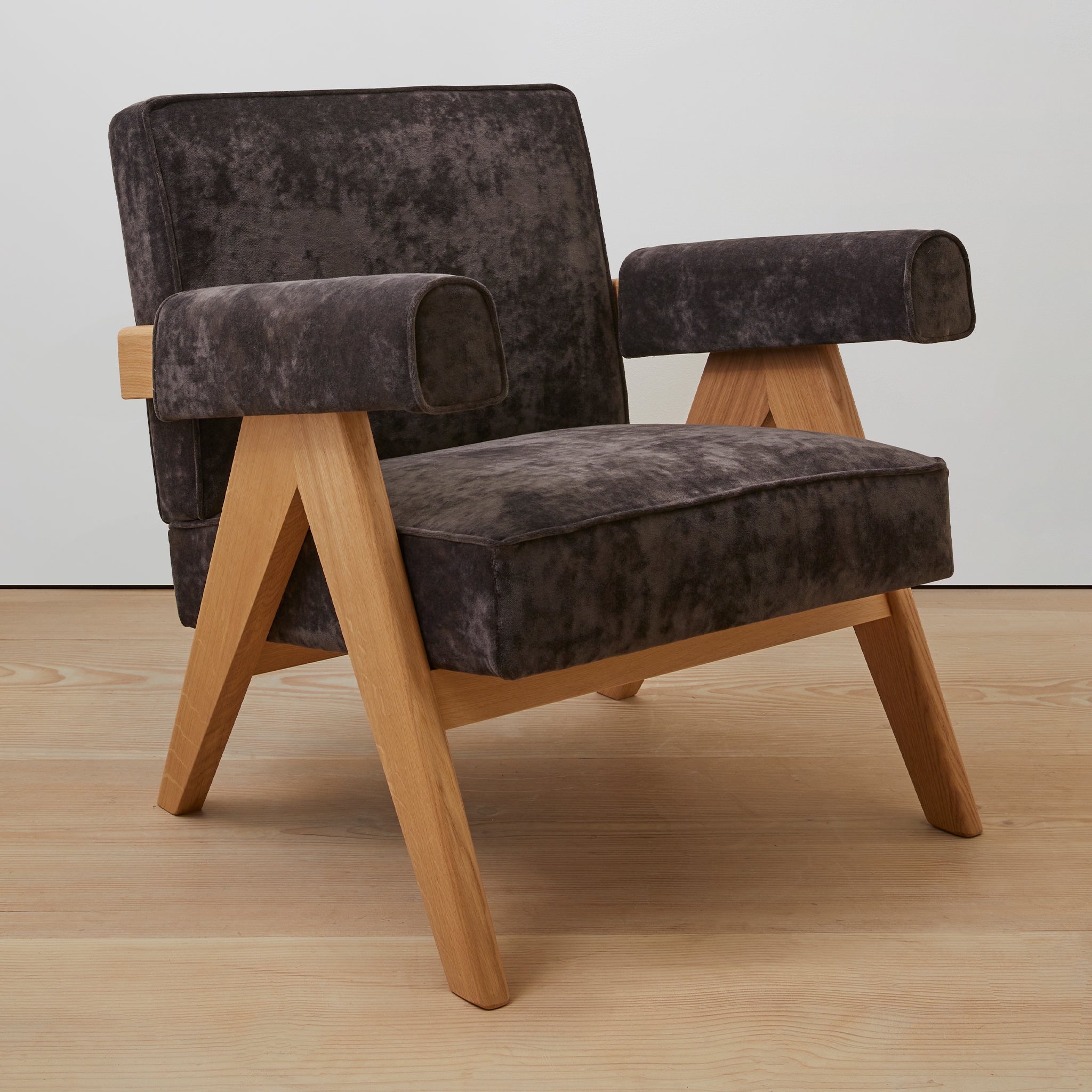 Main view of an authentic chandigarh lounge chair, pierre jeanneret era, natural oak frame, chocolate brown mohair upholstery, by Klarel #K35-36