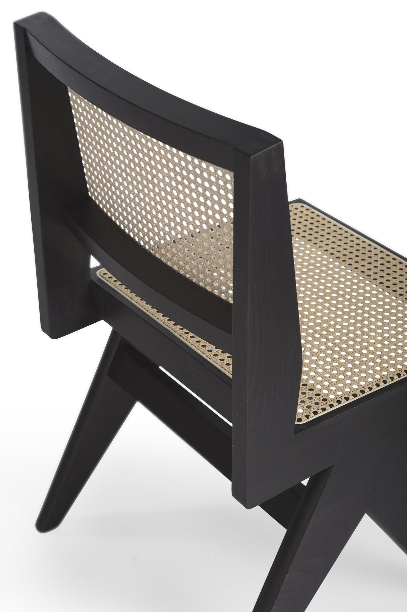 Close-up 1 of an authentic chandigarh side chair, pierre jeanneret era, black frame, viennese cane, produced by Klarel. #K38-2