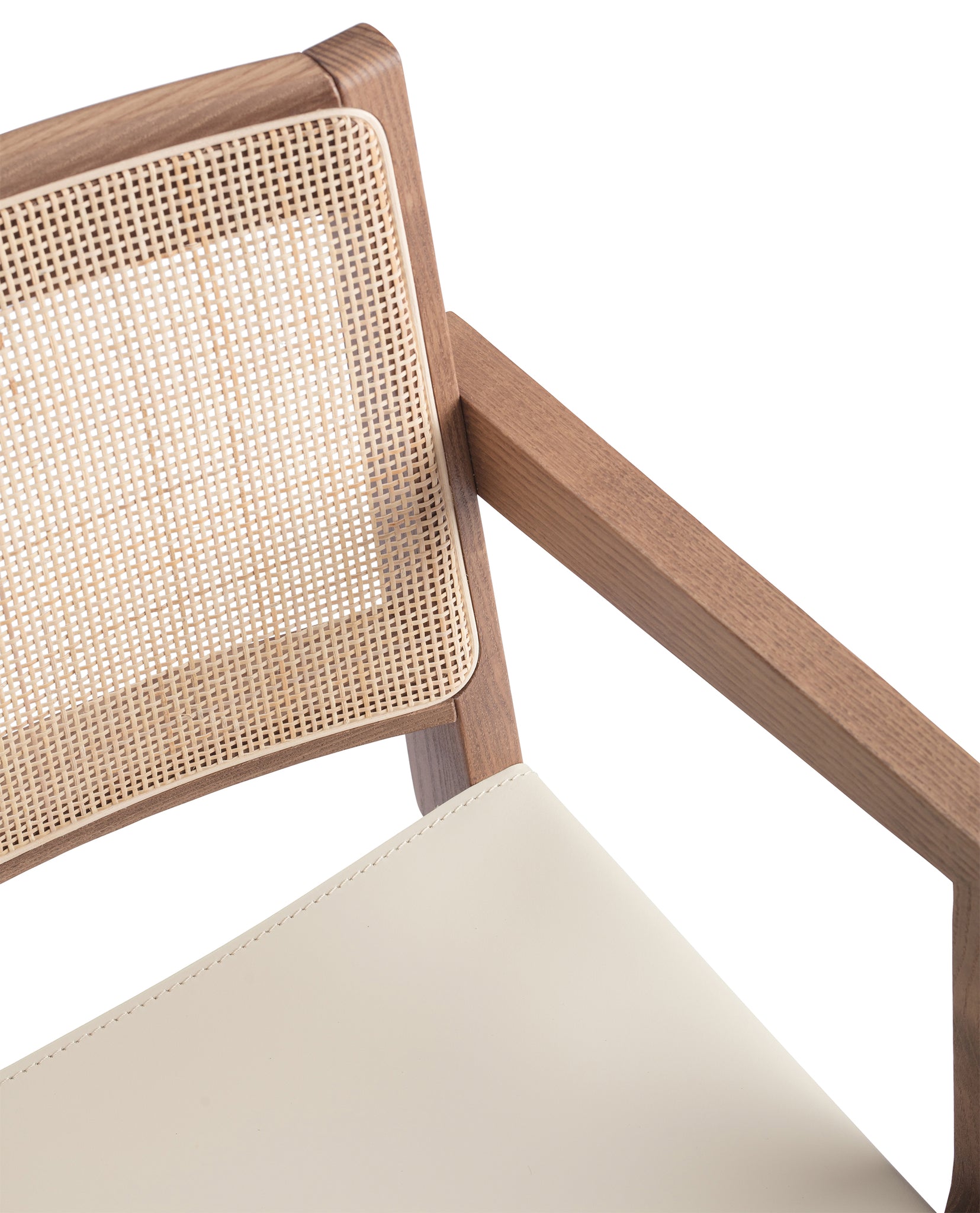 Close-up 1 of an "Elye" designer dining chair, walnut stained ash frame, square weave cane back, contract grade off white leather seat, produced by Klarel in Italy. #K40-1