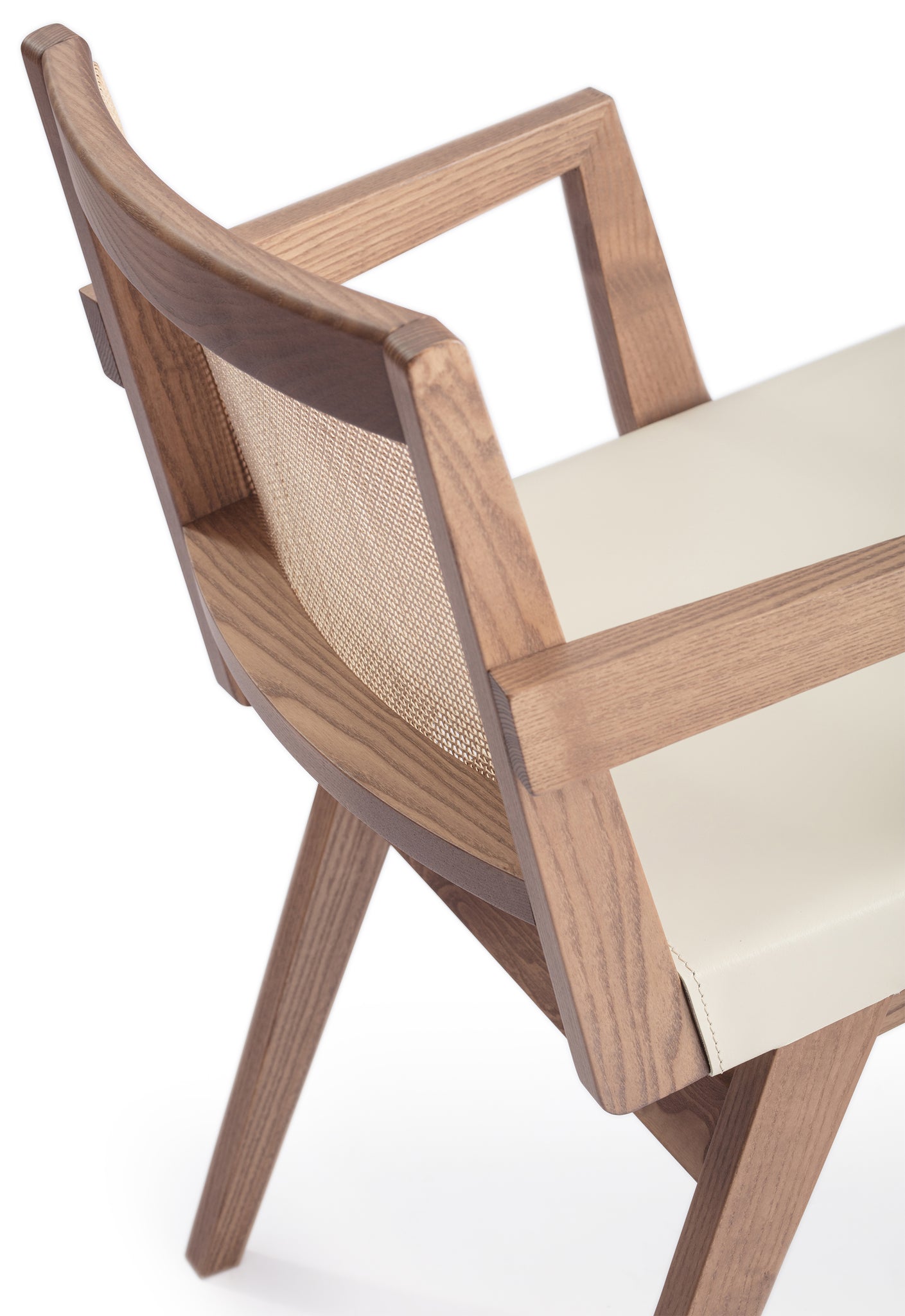 Close-up 2 of an "Elye" designer dining chair, walnut stained ash frame, square weave cane back, contract grade off white leather seat, produced by Klarel in Italy. #K40-1