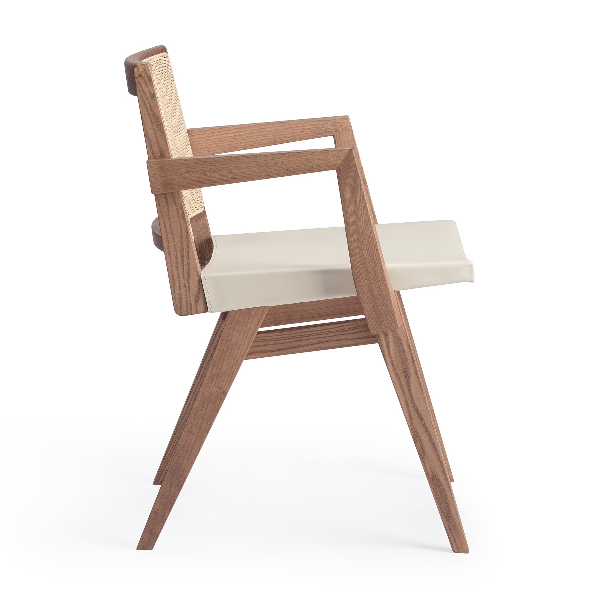 Side view of an "Elye" designer dining chair, walnut stained ash frame, square weave cane back, contract grade off white leather seat, produced by Klarel in Italy. #K40-1
