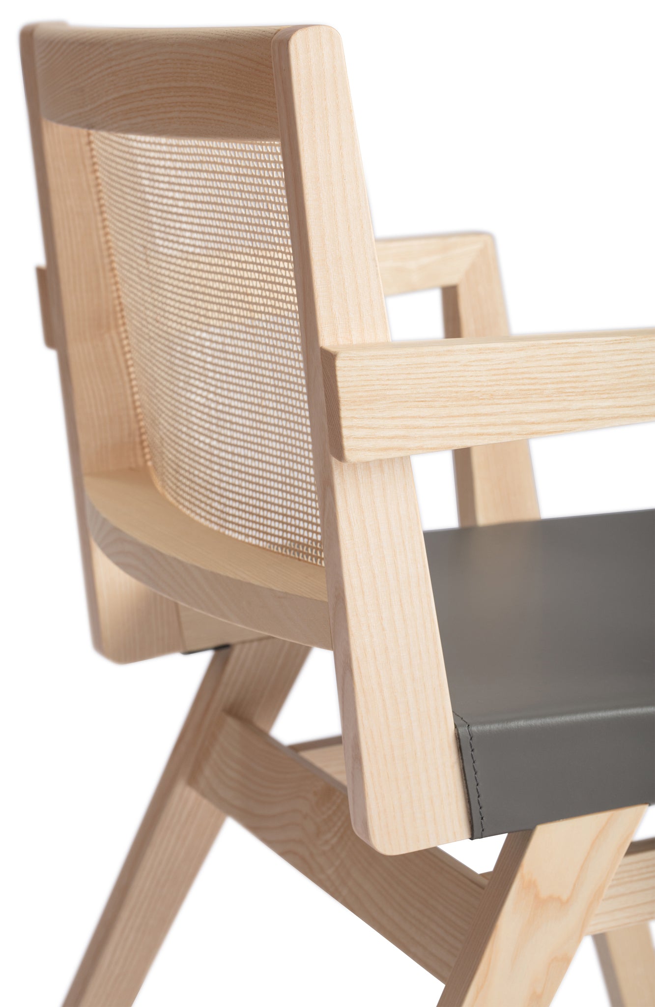 Close-up 1 of an "Elye" designer dining chair, walnut stained ash frame, square weave cane back, contract grade off white leather seat, produced by Klarel in Italy. #K40-3