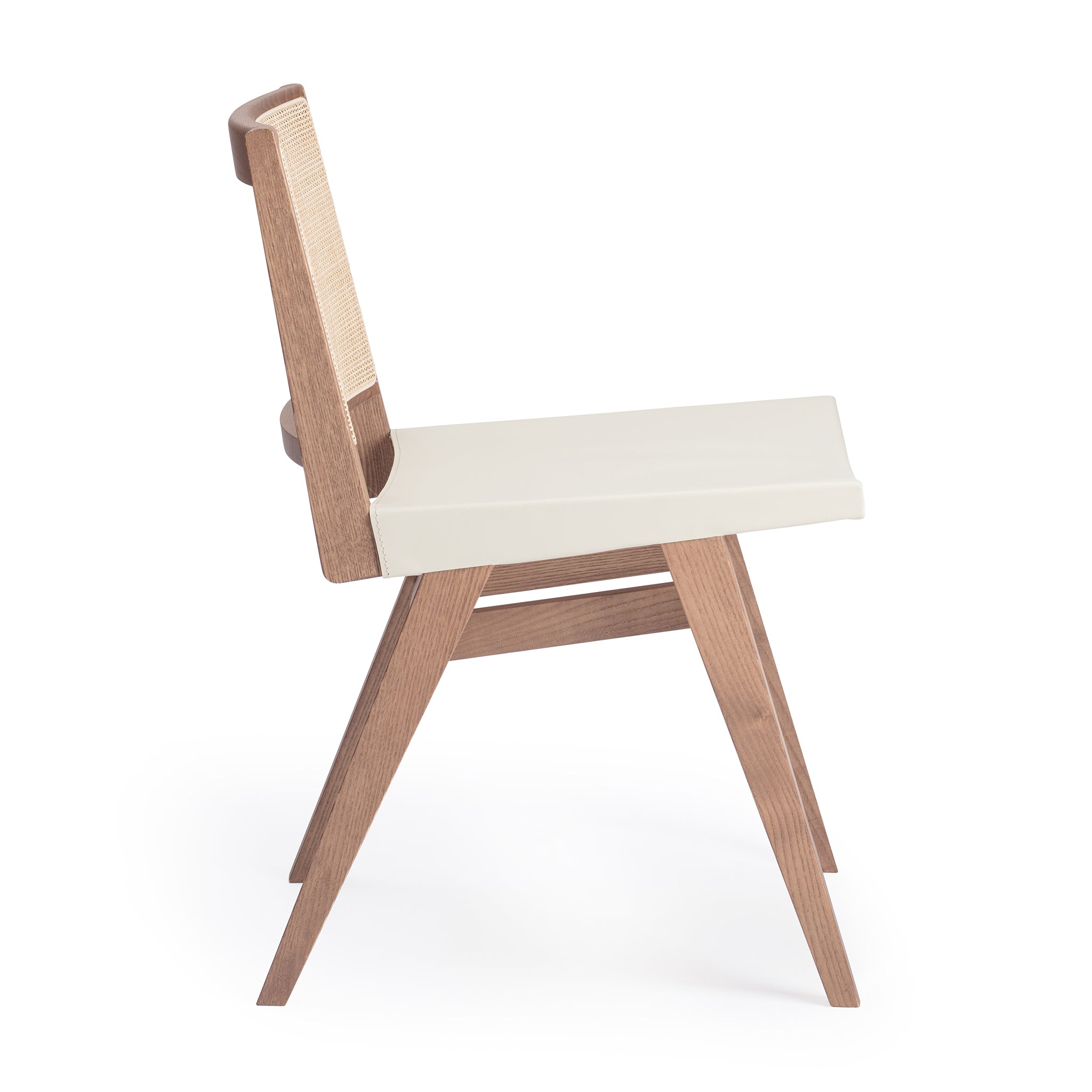 Side view of an "Elye" modern dining chair, walnut stained ash frame, square weave cane back, contract grade off white leather seat, produced by Klarel in Italy. #K41-1