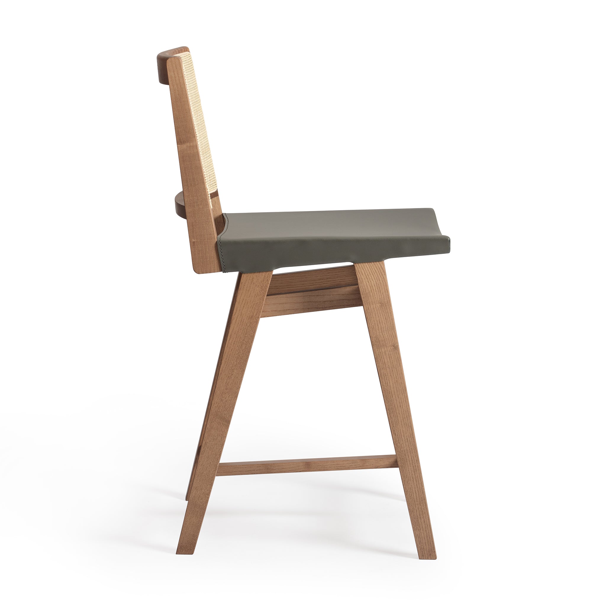 Side view of an Elye modern kitchen counter stool, walnut stained ash frame, square weave cane back, contract grade gray leather seat, produced by Klarel in Italy. #K43-2